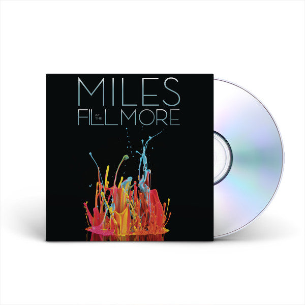 A CD album titled 'MILES AT THE FILL MORE' with a black cover featuring a colorful paint splash design and a silver CD partially visible behind the sleeve on a white background.