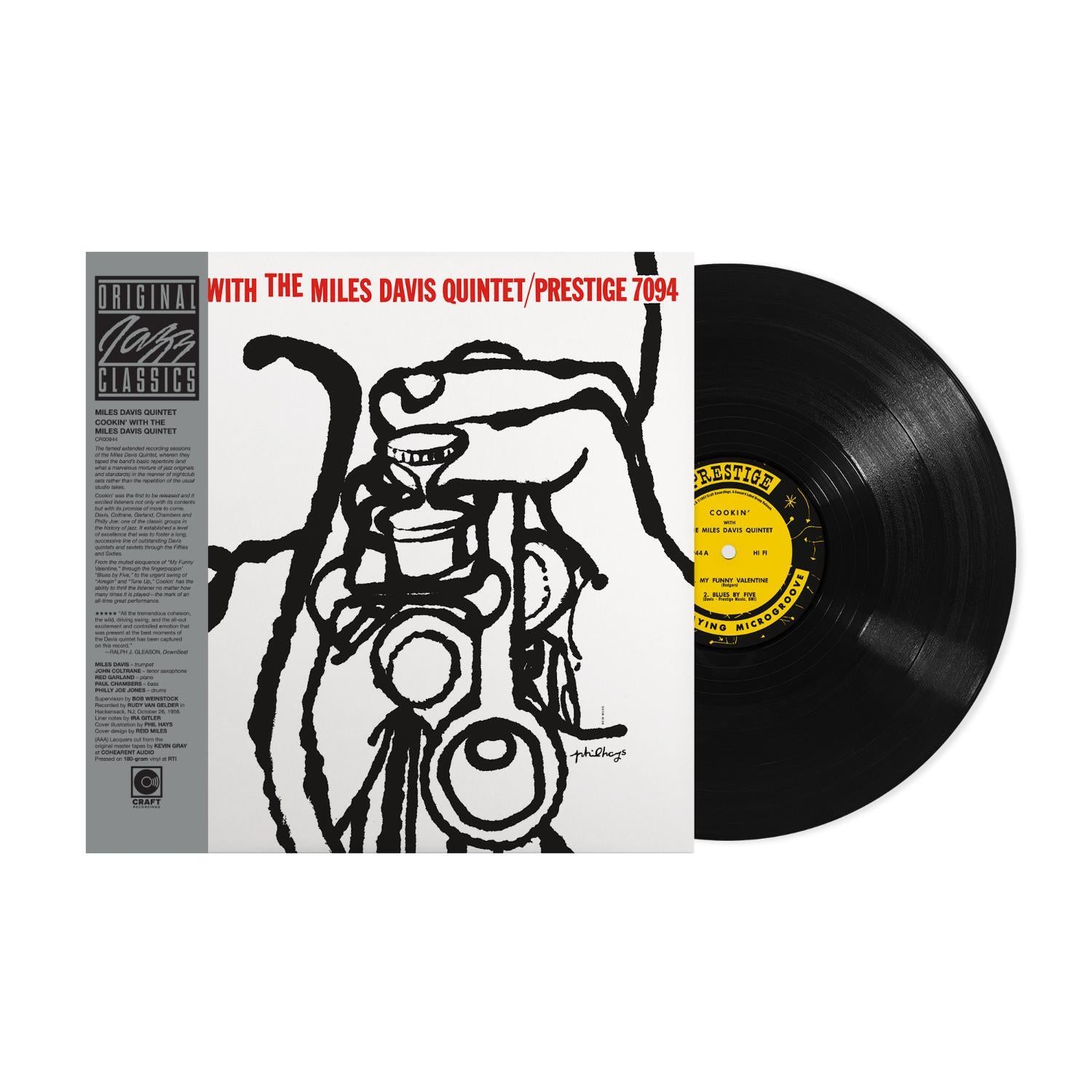 Vinyl record with cover featuring Miles Davis Quintet on a white background